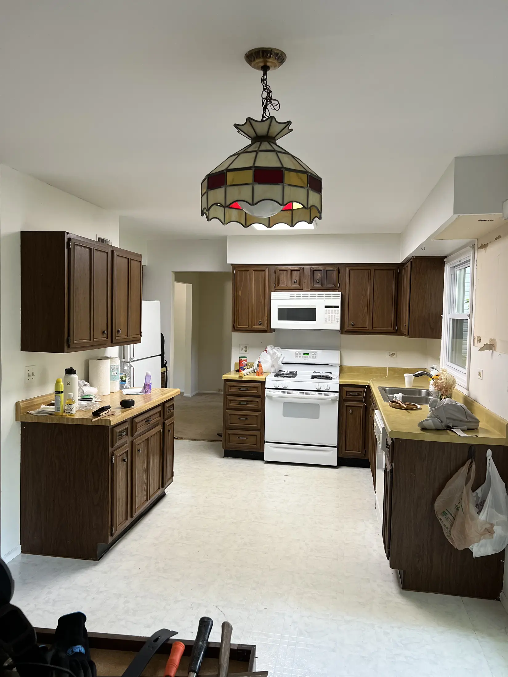 Existing kitchen work area before the cabinetry and finishes were replaced